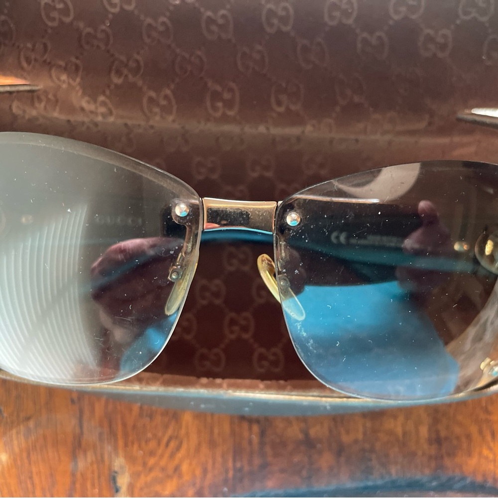 Gucci Black and Gold Rimless Glasses